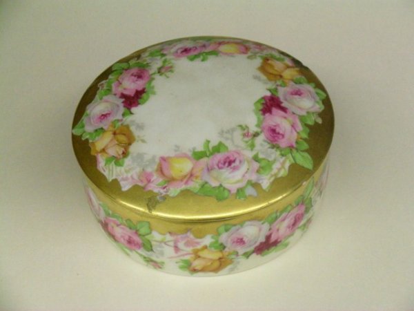 LIMOGES FLORAL DRESSER BOX: Signed. Minor repair to lid edge. 5" d.