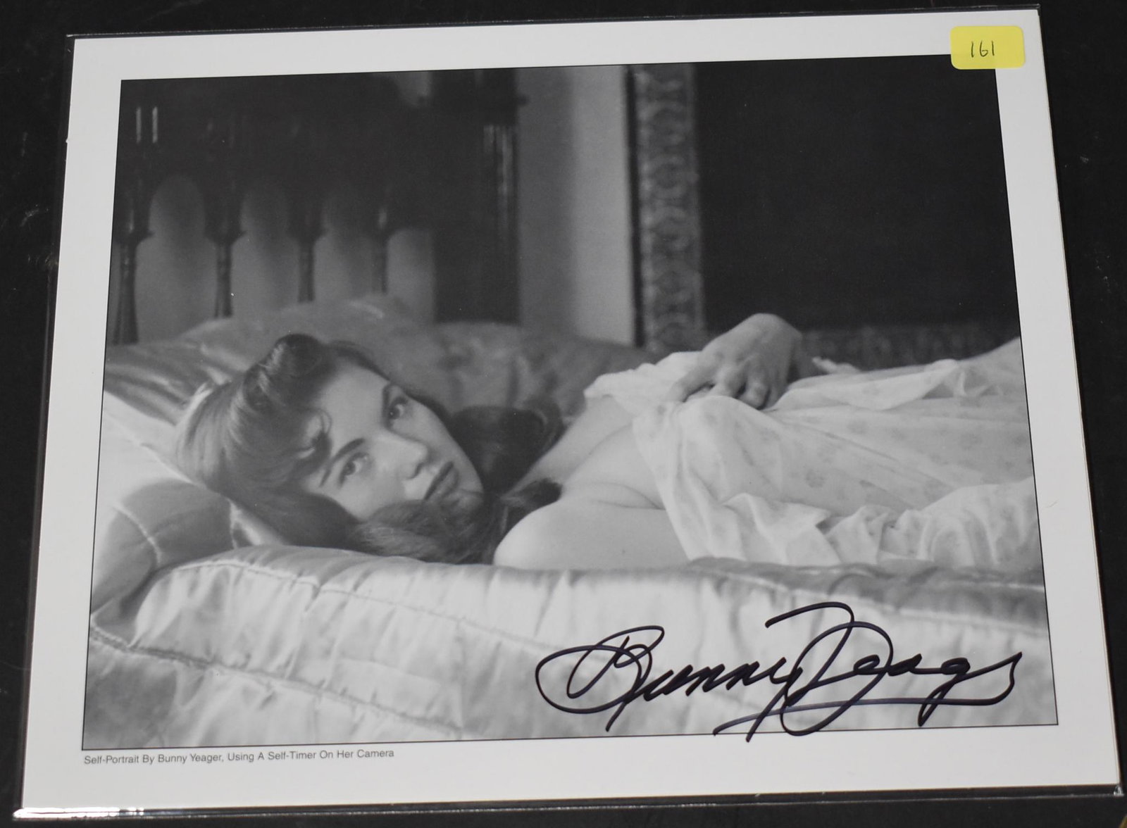 Sgd. Bunny Yeager Self Portrait Photo: Self-Portrait by BY using a self timer on her camera. Sgd. in sharpie. 8 x 10.