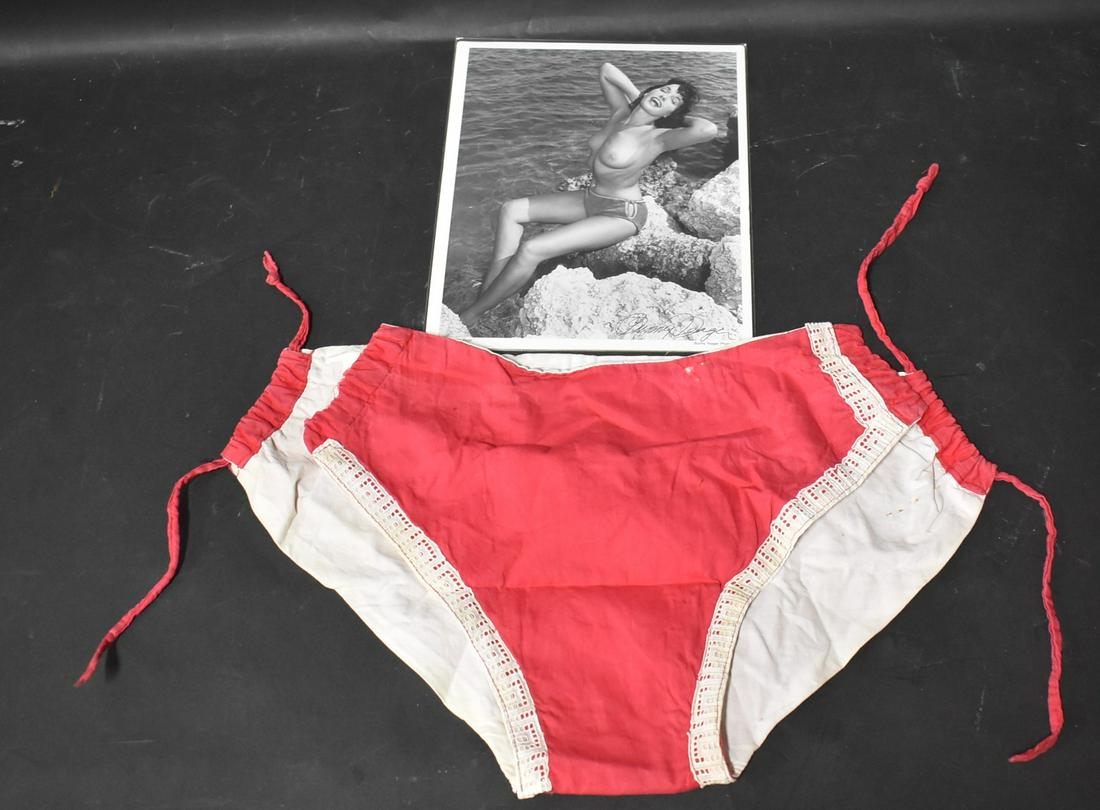 Vintage Bettie Page Worn Bikini Bottom With Picture (2): 3 items in lot. 1 Red Bikini Bottom. Worn By Bettie Page With 1 Signed Picture Of Bettie Page Wearing Bathing Suit Bottom Signed By Bunny Yeager and one unsigned.** Additional picture added to show di