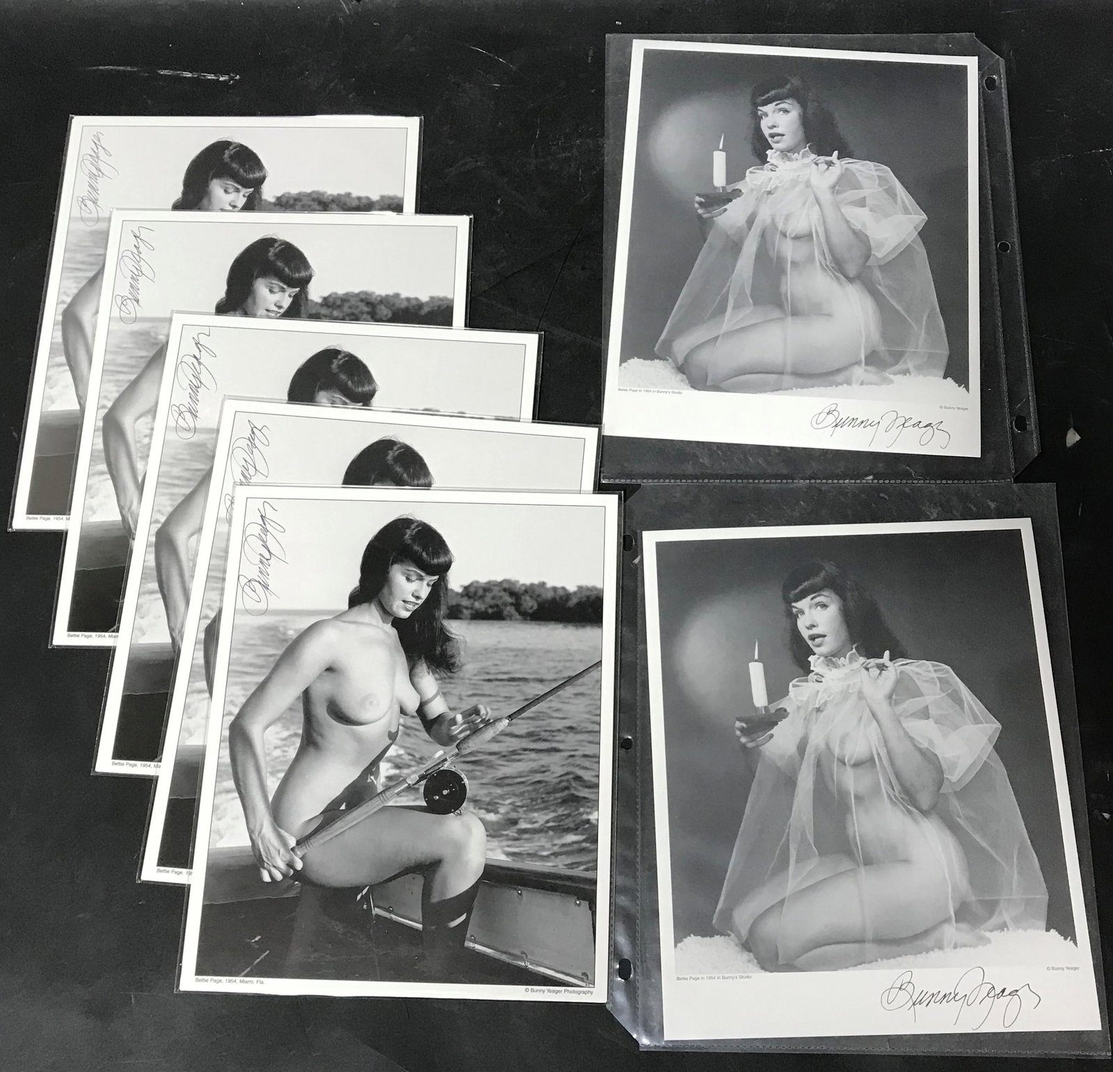 (7) Photos Of Bettie Page Sgd. Yeager: 8x10 Double Stock (5) Of Bettie Page With Fishing Pole. (2) Of Bettie Page In Sheer Holding Candle. All Signed By Bunny Yeager