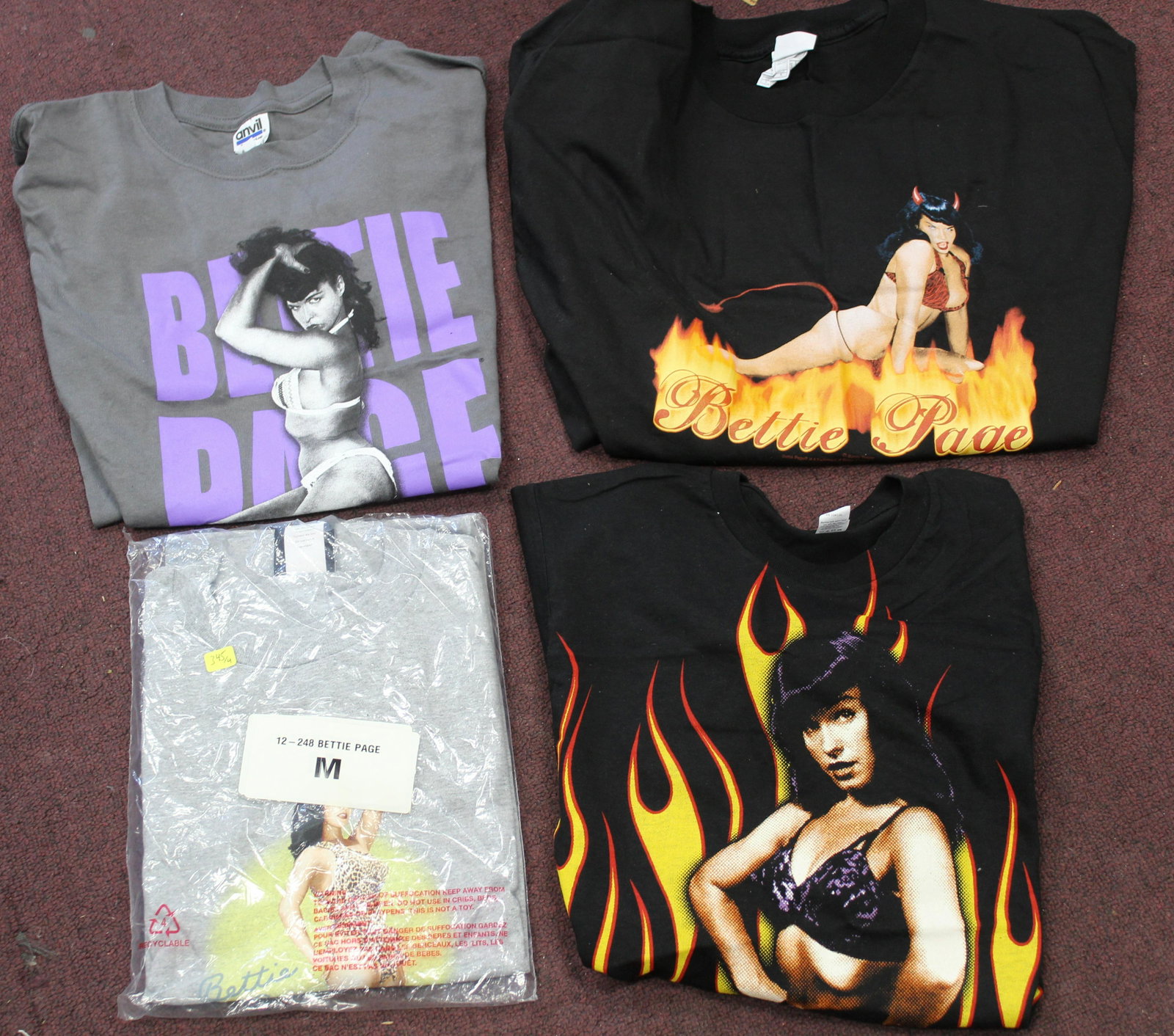 Collectible Bettie Page T-Shirts (4): 4 different designs. 2 M , 1 S, and 1 XL.