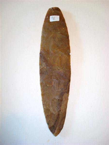 STONE WEAPON OR TOOL: Dug in Tennessee. Smooth surface with wavy effect. 11 3/4" L.