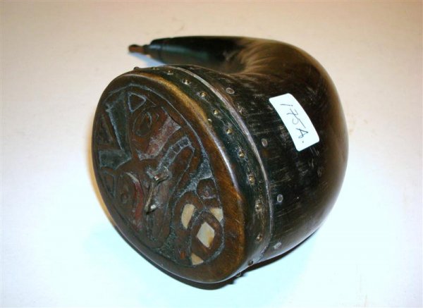 TLINGIT HORN AND WOOD WATER BOTTLE: Decorated water bottle. Horn with a carved wood face characterized by abalone and copper facial inserts mounted with brass tacks. 19th C. Traded in 1940 on an Alaska visit to the tribe., 9" L.