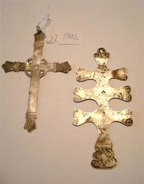 TWO TRADING ROUTE SILVER PCS.: One a cross form and a second. Pierced for hanging. The cross from an Alabama county. The second pc. is stamped Montreal and with a hallmark as well as makers mark T. Hall. Also marked from an old tra