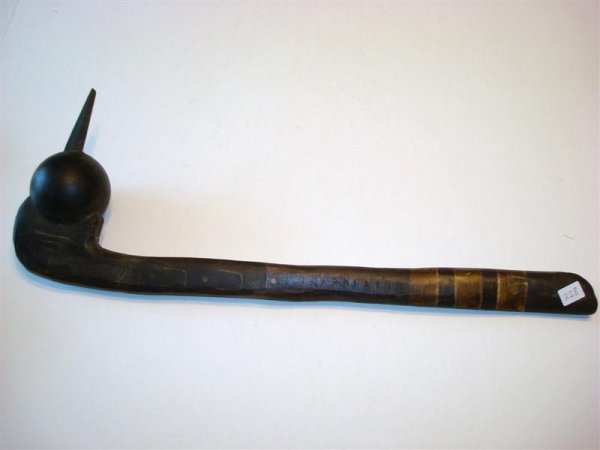 PLAINS INDIAN CLUB WEAPON: Arrowhead prominence. Carved wood club. Paint decorations(rasp marks) on the carved wooden handle. Repair to the arrowhead point. 22" L.
