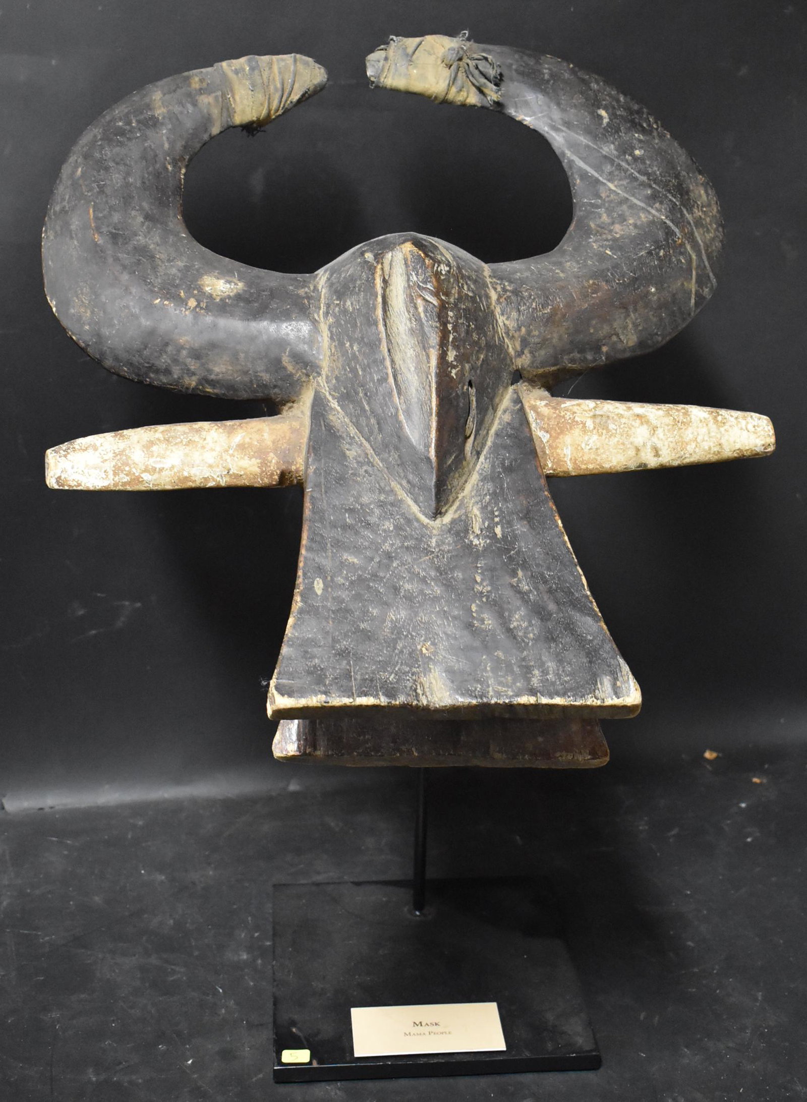 NIgerian Buffalo Helmet Mama People: 22 x 20. On metal stand.