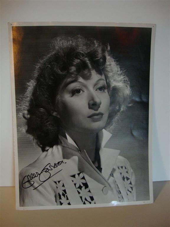 CLARENCE BULL PHOTO OF GREER GARSON AND LC: 10" W X 13" Photograph, (VF) with back seal - "Please credit MGM Photo by Clarence Bull", Photoplay magazine library stamp. Publicity Sn