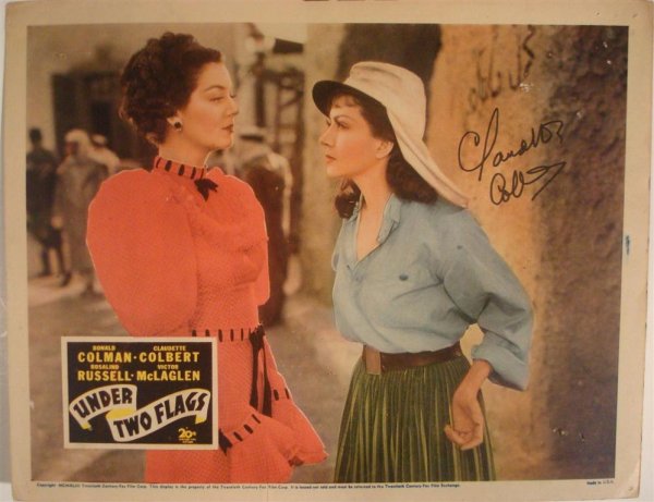 UNDER TWO FLAGS, COLBERT, DOUGLAS: (2) LC, 11" W X 14" H, 20th Century Fox, 1936, one autographed by Claudette Colbert in ink, (VF-NM)