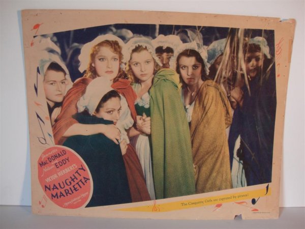 NAUGHTY MARIETTA LOBBY CARDS: 11" x 14" Jeanette MacDonald, Nelson Eddy. (MGM, 1944) One marked R.E. Teichert Theatre Collection. F (Pinholds & small paper loss upper & lower margin on one)
