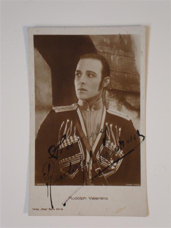 RUDOLPH VALENTINO SIGNED PHOTOGRAPH: United Artists publicity photograph German postcard. Stamped and sent to Villa Tivoli, signed at front. Rare autograph of the screen's greatest lover. 3-1/2" x 5-1/2"