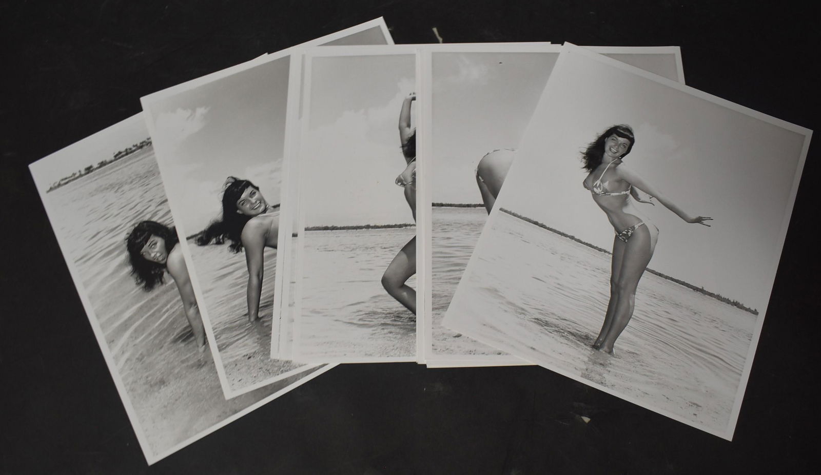 (12) Photos Bettie Page.: 8x10 double Stock. (12) Photos Bettie Page, On beach in Bikini. All Different Poses of Bettie Page. By Bunny Yeager Photography.