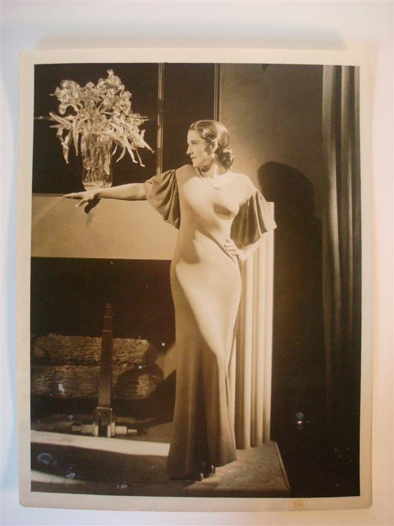 HURRELL PHOTO OF NORMA SHEARER: Photograph of Norma Shearer 10" W. x 12 3/4" H. MGM with embossed Hurrell stamp at the front and "Please Credit Hurrell" backstamp. VF