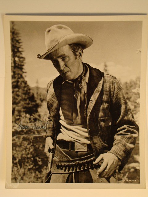 SIGNED JAMES STEWART PHOTOGRAPH: Publicity still in character for The Naked Spur. Typed publicity snipe at the back. Signed in blue ink, "James Stewart" (some smudging) 8" x 10" (F)