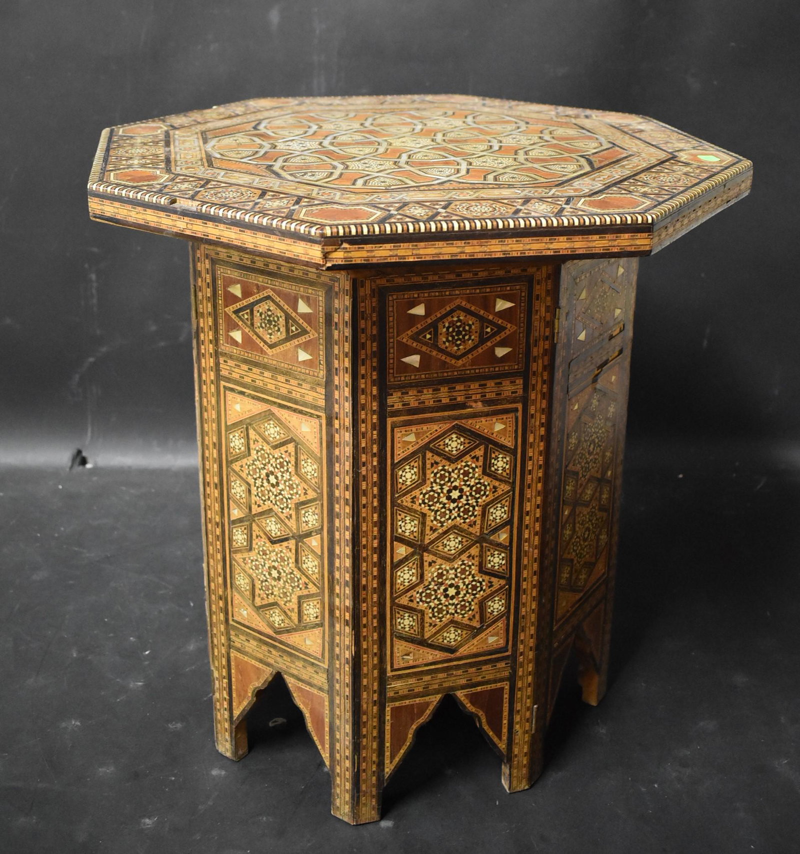 Moorish Intricate Inlay Table: Removable top and foldable legs. Some missing inlay, scatches. 19.5 x 20 x 24.