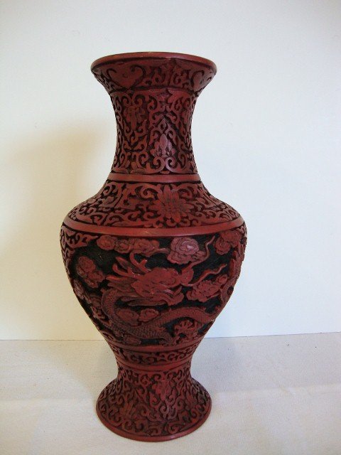 CARVED CINNABAR VASE: Dragon decorations. 12" H.