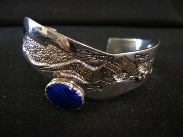 STERLING SILVER CUFF BRACELET: Sterling silver cuff bracelet with salamander (lizard) design and blue lapis stone .