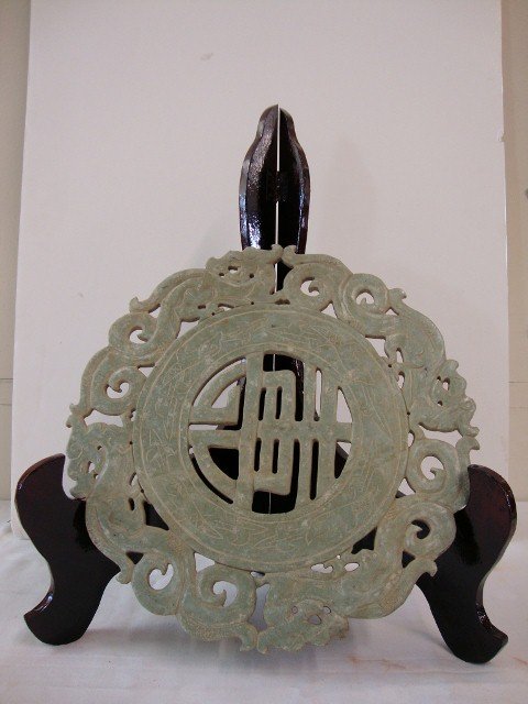 CARVED STONE MEDALLION WITH STAND: 11 1/2" D. There is no lot 648 and 649. Lot #650 is next.