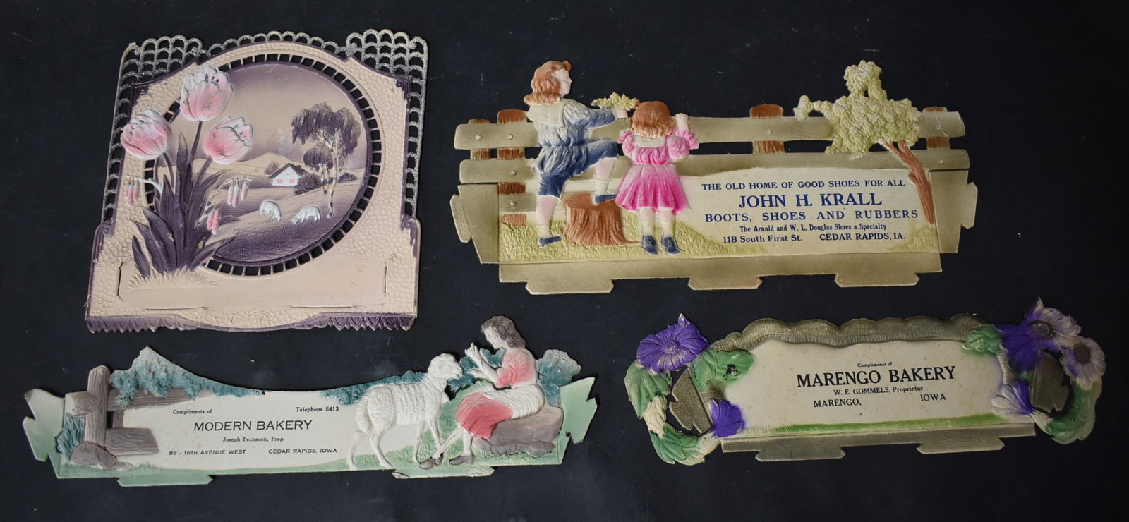 Collector's Lot of Victorian Die-Cuts (4): Modern Bakery, Cedar Rapids (16" L); Marengo Bakery, Marengo, Iowa (14" L); John H. Krall, Boots Shoes and Rubbers, Cedar Rapids (16" L); and one unidentified (10" x 10").