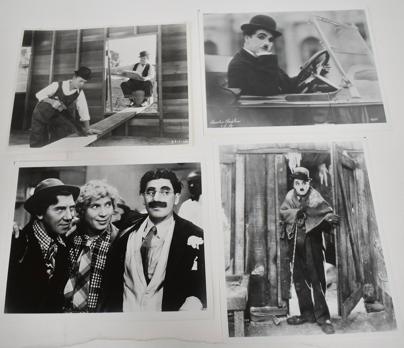 Early Comedians Photos (4): Two of Charlie Chaplin, one of the Marx Bros., and one of Laurel and Hardy. All 8 x 10.
