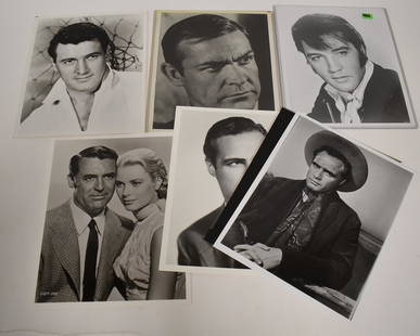 Hollywood Leading Men Photos and Brando Negative (9): Marlon Brando publicity photos (2) with an original negative for the early portrait; Rock Hudson; Carrie Grant (with Grace Kelly); Elvis; Tarzan; and one unidentified. All unidentified.