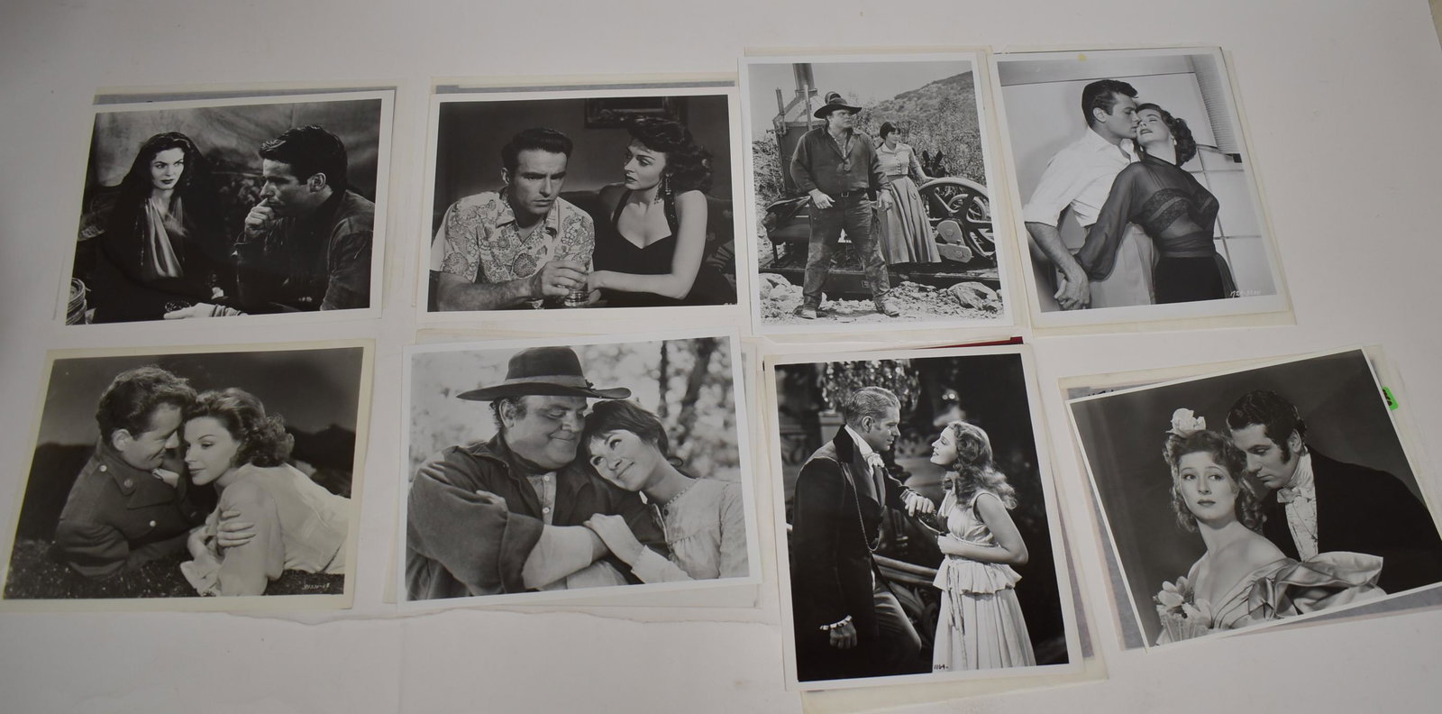 Hollywood Couples Photos and Negatives (16): Leading co-stars photographs and the negatives from which they were made. Includes Tony Curtis with unidentified co-star; Montgomery Clift; Judy Garland; and many others. 8 x 10.