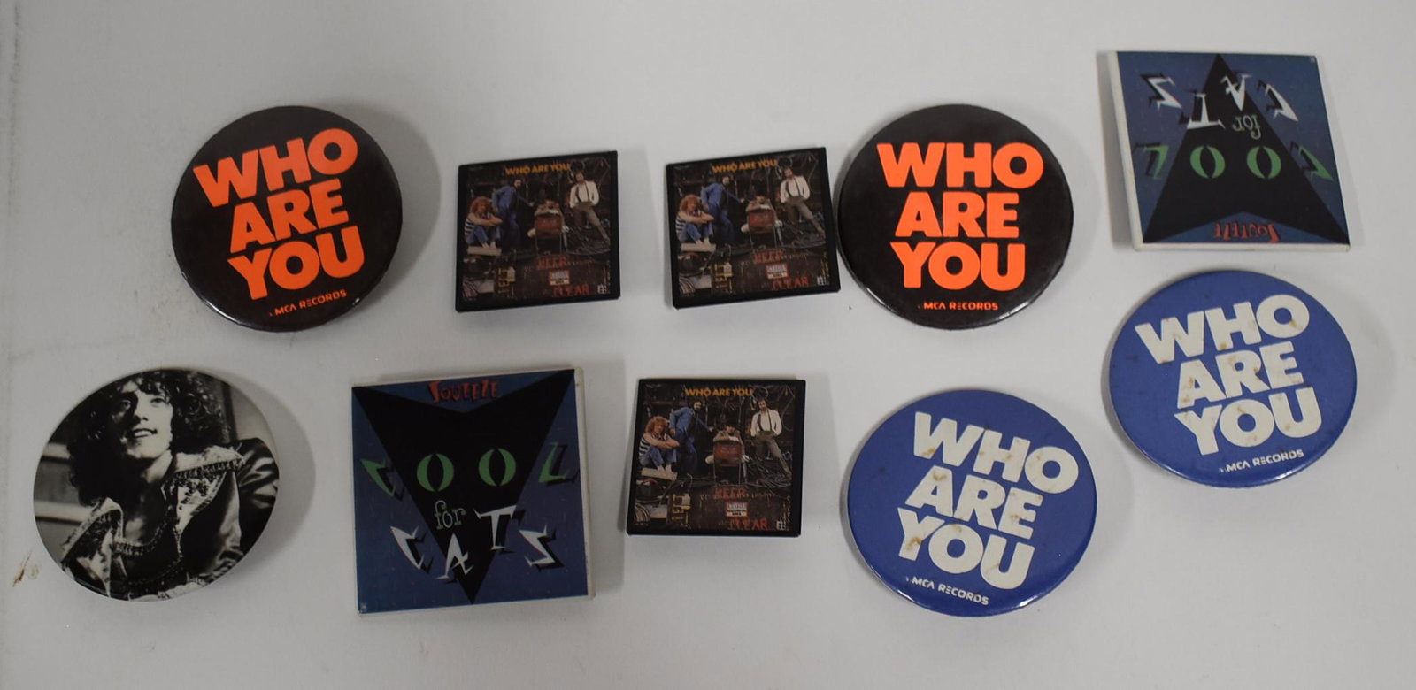Collector's Lot of Pinbacks Who Are You and Cool for: Varying sizes. 2" x 2" square and 2.5" round.