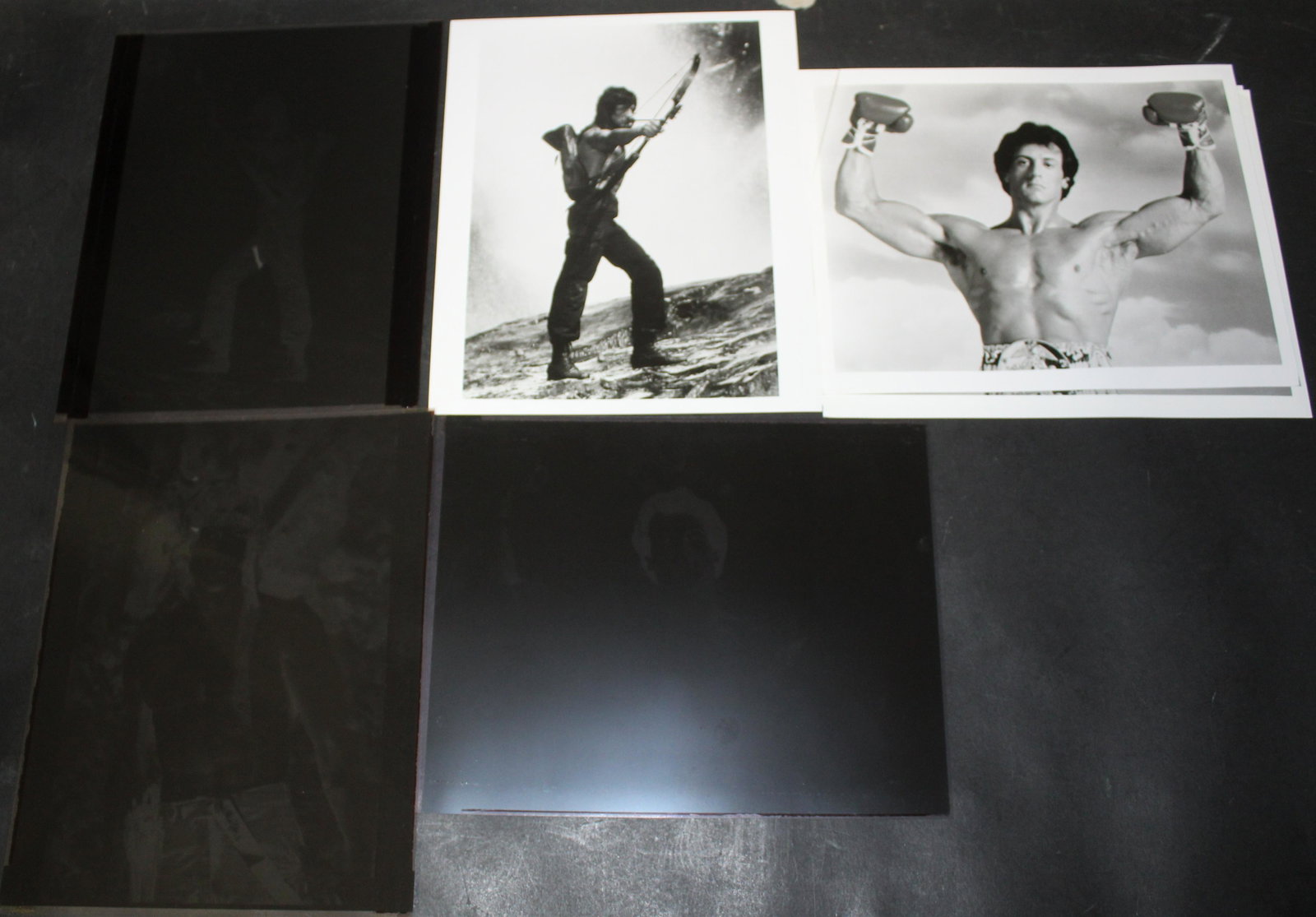 Sylvester Stallone Photos and Negatives (5): Includes a photo from Rocky and its original negative; a photo from Rambo and its original negative, and one additional Rambo negative. 8 x 10.