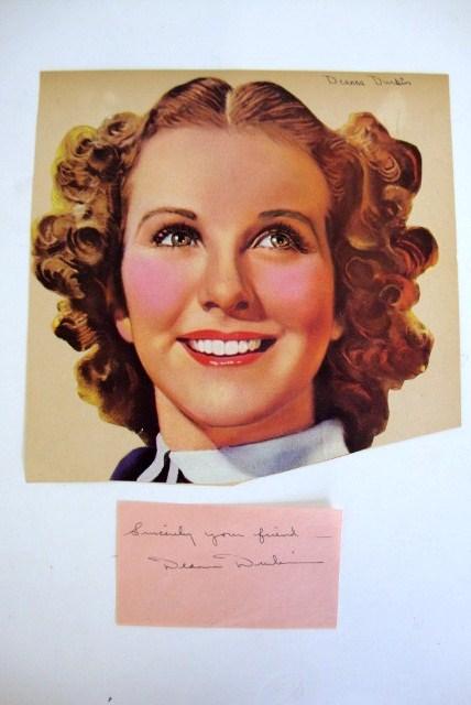 DEANNA DURBIN AUTOGRAPH: On a pink paper, 4 x 2 signed in black ink, "Sincerely your friend, Deanna Durbin" VF