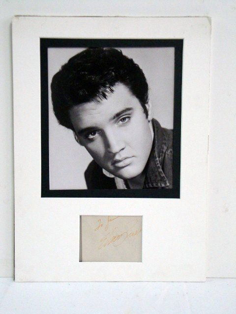 ELVIS PRESLEY PHOTOGRAPH AND AUTOGRAPH: Cut signature " To Jan, Elvis Presley" matted with a 7"x 8" photo. Because back of paper was autographed by Sharon Tate, this 7 1/2" x 9" photo and cut autograph are included in the lot. Overall size