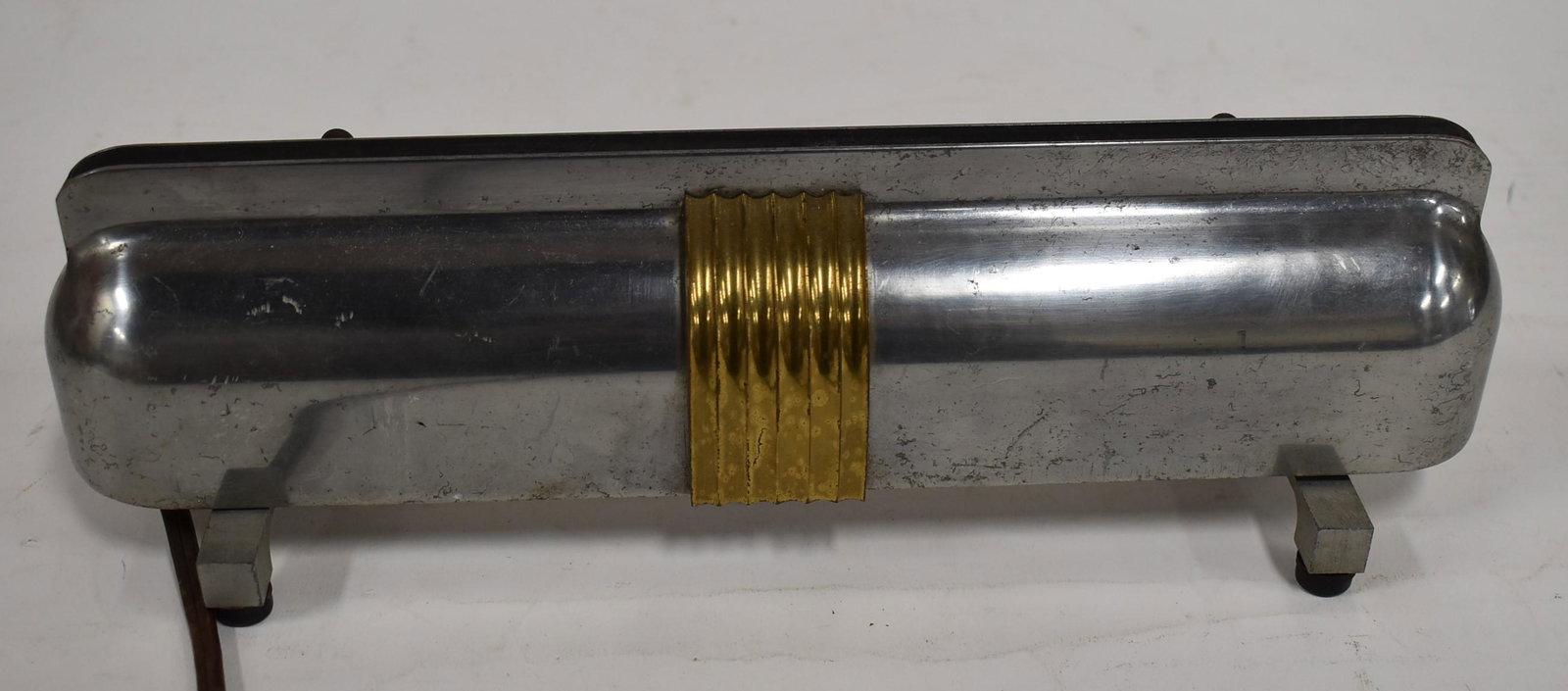 1950s Art Deco Advertising Light Sign: Chrome.Arri Bros. Much of label worn and indiscernible. 4 in H x 12.5 in W.