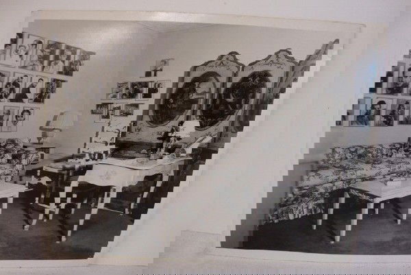 CLARENCE SINCLAIR BULL PHOTO FOR MGM: Publicity candid depicts Jean Harlow's sitting room on the second floor of the star's home. Detailed publicity snipe at back outlining decoration details and color. Celebrity portraits visible on back