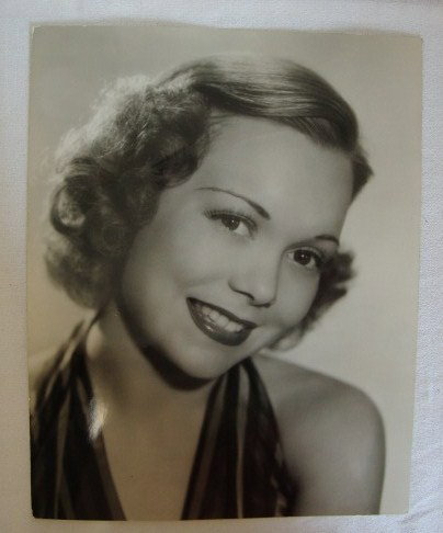 JANE WYMAN PORTRAIT - SCOTTY WELBOURNE: Dell Pub. Co. backstamp. Date stamp for 1937. Publicity portrait for He Couldn't Say No. Back stamp for Scotty Welbourne. 10 1/2 x 13 /14. VF.