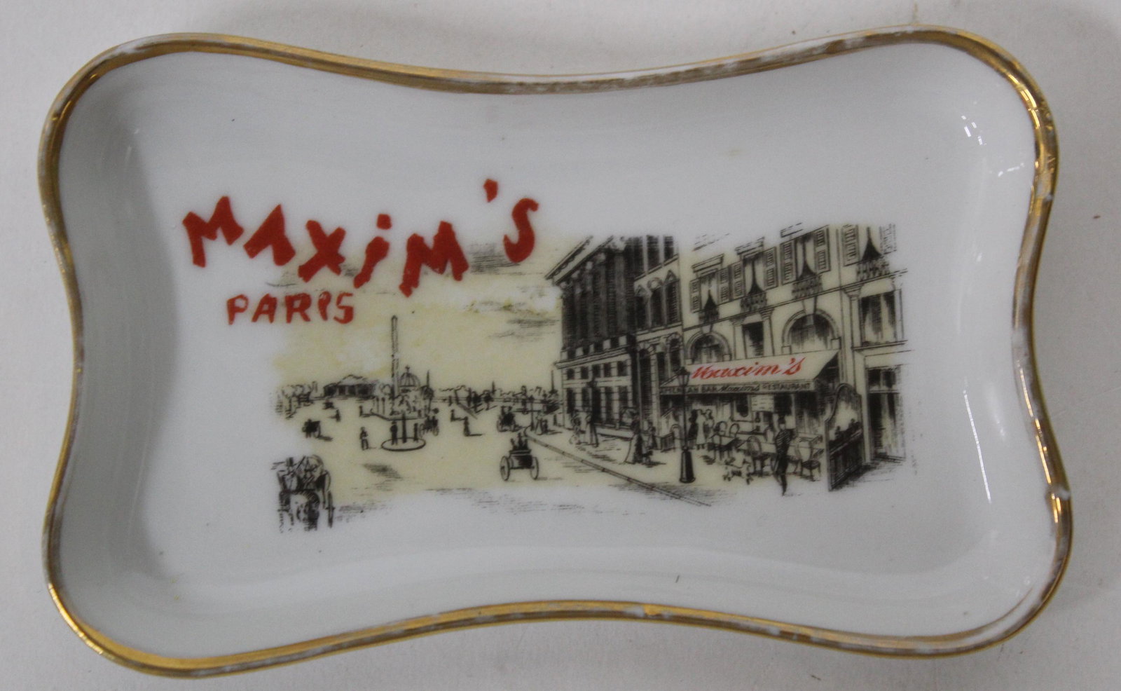 Maxim's Paris Tip Tray: Porcelain. Marked on the underside. 5 in.