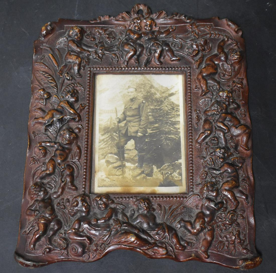 Figural Cast Iron Framed Photo: Soldier in Uniform Overall Size 11"H x 9"W. Image Size 6"H x 4.5"W