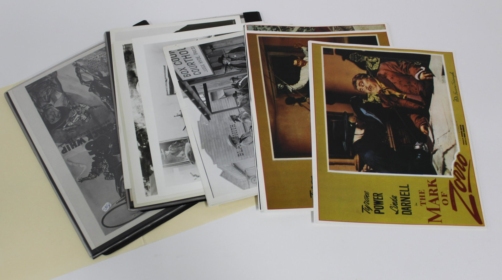 Collector's Lot of Zorro (17): Window cards for the Mark of Zorro (2); Window cards for the Sign of Zorro (5); Photos, 1947, for the Son of Zorro (4); Photos for Zorro Rides Again (3); and one unidentified Zorro photo. The lot also