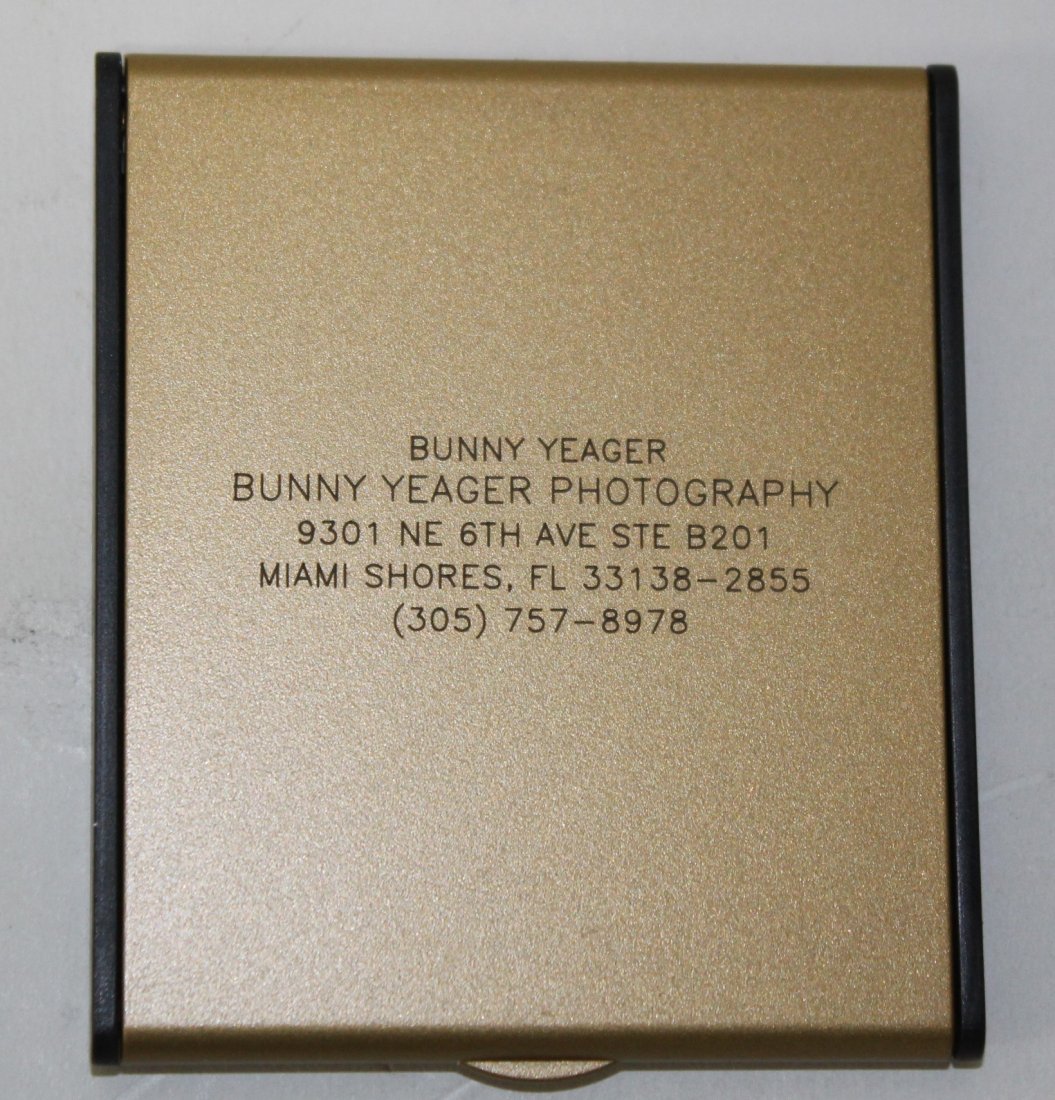Bunny Yeager Promotional Compact Mirror: Promotional Give-Away for Bunny Yeager's Photoraphy Business. New in the box. Gold Tone lift top compact mirror. with Bunny Yeager Bunny Yeager Photography 9301 NE 6th Ave. Ste. B201 Miami Shores , Fl