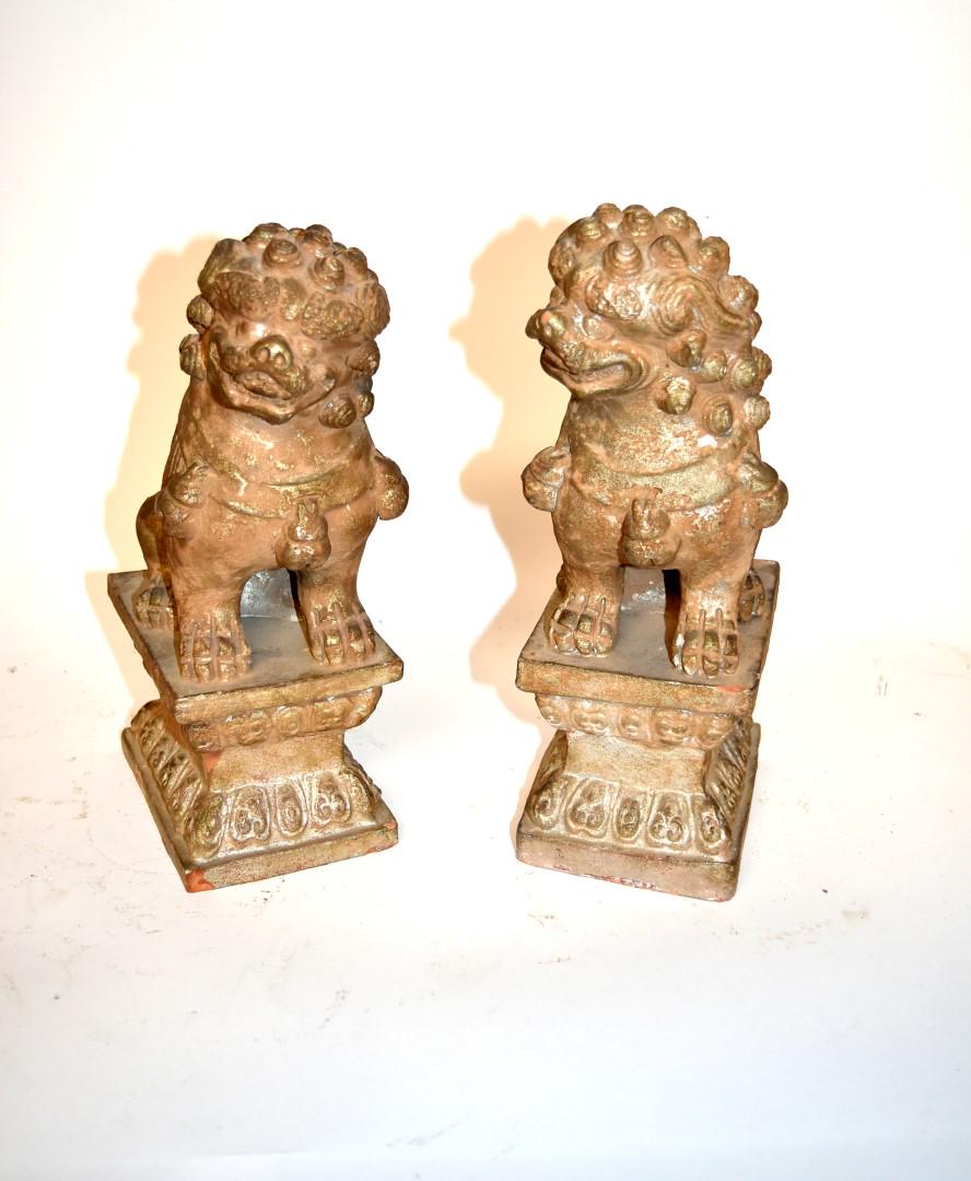 Pair of Chinese Pottery Foo Lions: Pair of terracotta foo lions on pedestals; 12in.H. x 5.5in.W.