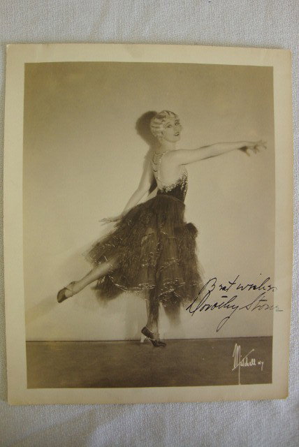 DOROTHY STONE, ISP: 1930's Mitchell N.Y. Publicity photograph signed in black ink Best Wishes, Dorothy Stone. Sepia tone. Matte finish. Photographer's mark lower right. (Dorothy Stone appeared in 1936 "Revolt of the Zomb