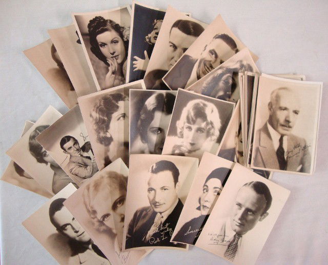 FORTY TWO HOLLYWOOD PHOTOS WITH PRINTED SIGNATURES: All publicity photographs with printed signatures in the photographs. Includes Dick Powell, Madeleine Carroll, Corinne Griffith, Betty Furness, Bessie Love, Mary Martin, Eddie Cantor, Lewis Stone & Jo