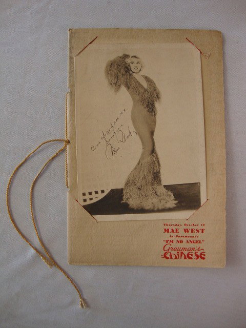 MAE WEST I'M NO ANGEL PROGRAM: Grauman's Chinese Theatre program for the Oct. 12th, 1933 opening of Paramounts, I'm No Angel. Cover contains a 5 x 7 removeable "Come up and see me sometime Mae West" full length photograph. 32 pages