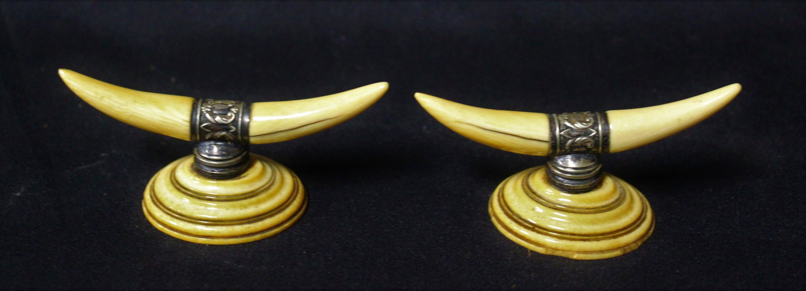 Antique Scrimshaw Carving Silver Mount Pen Rests (2): Approx 150 years old. Few minor chips at the base. 1.5 in x 3.25 in.