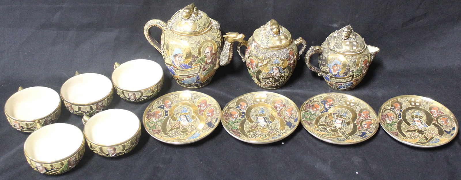 Satsuma Tea Set (12): 1 tea pot, 1 sugar, 1 creamer, 5 tea cups, and 4 underplates.