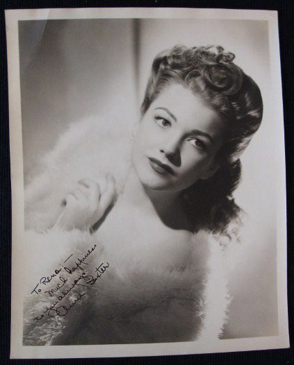 ANNE BAXTER SIGNED PHOTOGRAPH: Inscribed in black ink To Rena Much happiness to you always Anne Baxter. 8 x 10. F (crease upper left corner)
