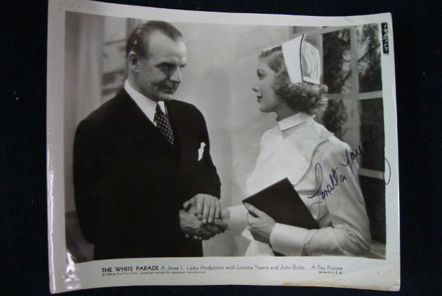 SIGNED LORETTA YOUNG WHITE PARADE PHOTO: 1934 Fox Film Corp. photograph from White Parade. Loretta Young with John Boles. Signed in black ink Loretta Young. 8 x 10. F