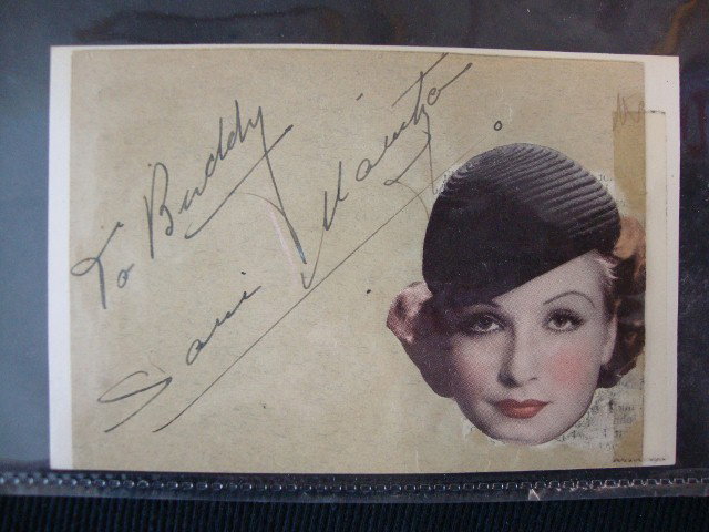 AUTOGRAPH ALBUM OF MARILYN DE WOLFE: Willoughby, Ohio. Willoughby High School, Age 14. Contains autographs of Bette Davis, Douglas Fairbanks Jr., Tony Martin & Don Ameche, Irene Ryan, as well as, Warren Hull (announcer for Good News of 1