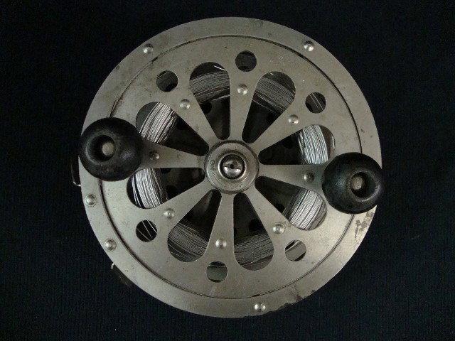 AMERICAN FLY FISHING REEL: American fly fishing reel, steel line. Marked "P.F. Lueger SAL-Trout No.1558, ebonized wood handle; 6in. W.