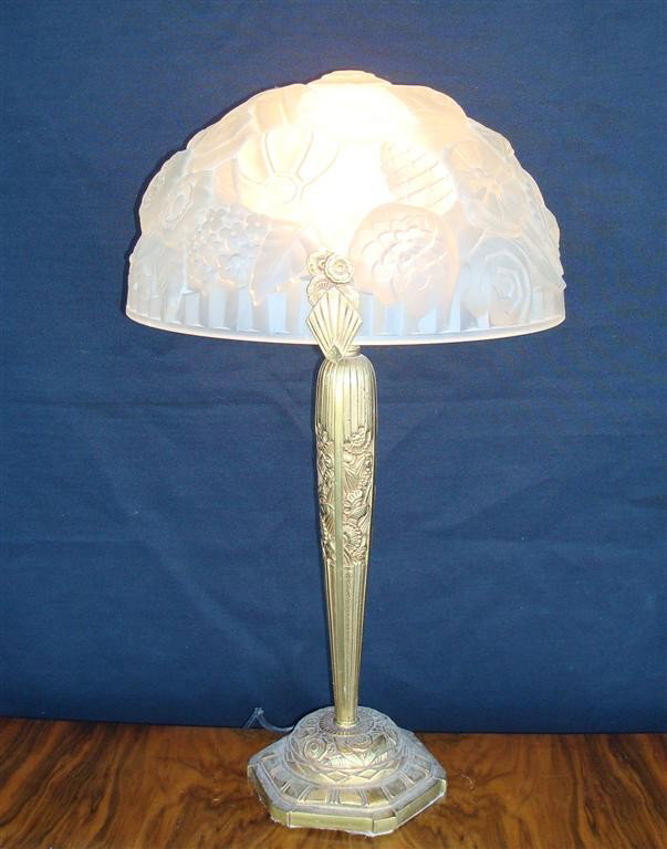 PAIR OF ART DECO LAMPS: pair of Art Deco lamps; frosted glass dome shades with all over molded floral design; on dore bronze bases with matching design; 22in. H. x 12-1/2in. Diam.