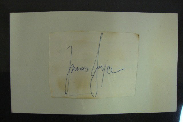 JAMES JOYCE AUTOGRAPH: James Joyce in blue ink on cut piece of paper pasted to 3 x 5 index card, staining. F