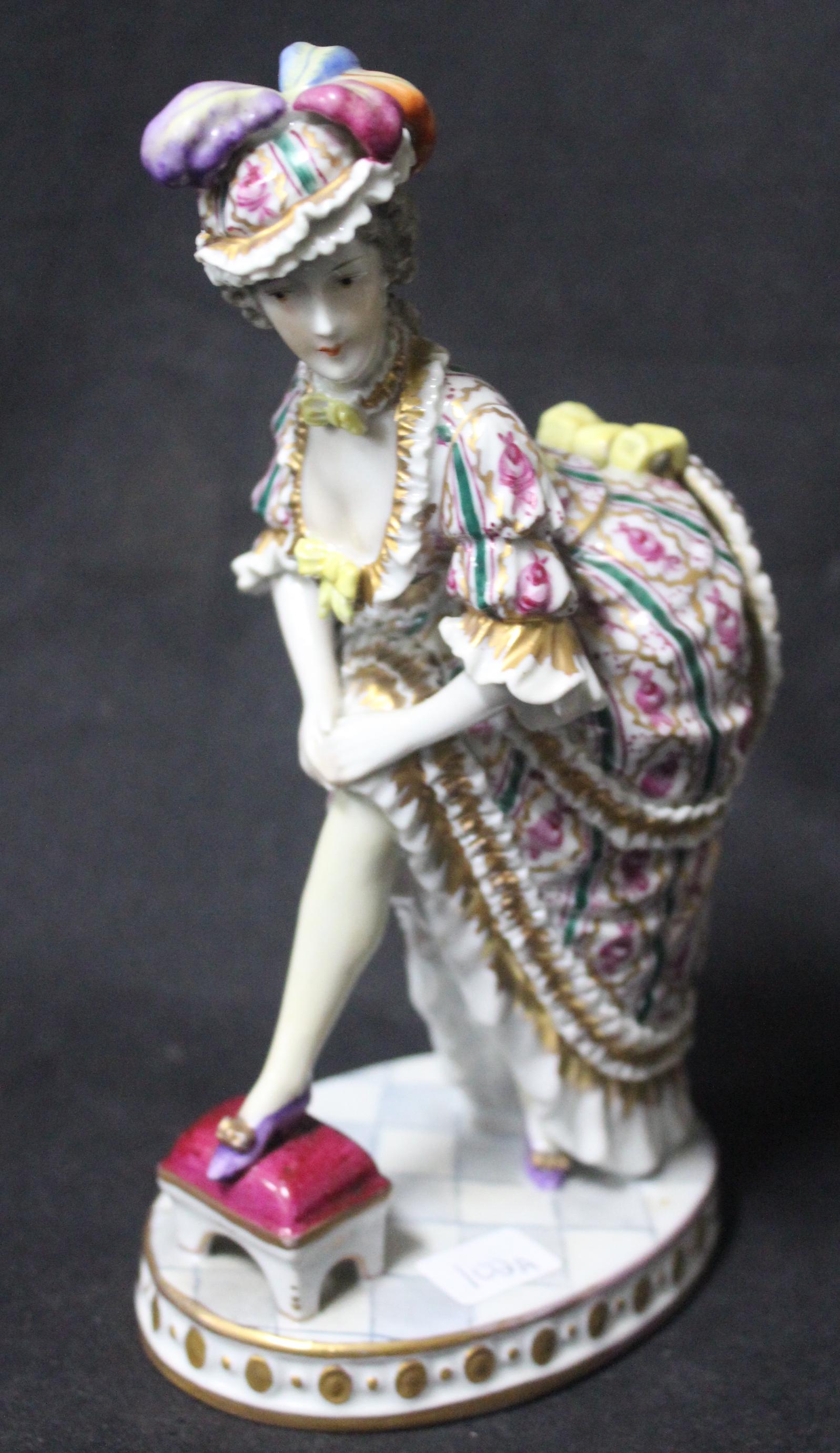 Unusual Euopean Porcelain Figure: Mechanical back of skirt lifts. Sevres like mark at the underside with the lettes G.T.. Old repair to lift portion. 7.5 in H.