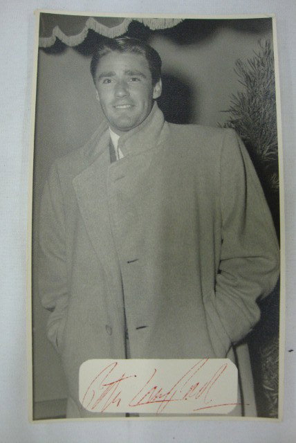PETER LAWFORD SIGNED PHOTO BY CARSTENS: Signed in red ink Peter Lawford. Backstamp for the photographer, Theodore Carstens, Los Angeles. 4-1/2 x 7-1/2 VF-F
